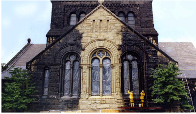 Cleaning bricks of a church - Bison Scaffold